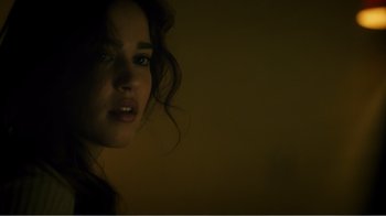 Movie still from “Rings” (2017), directed by F. Javier Gutiérrez – A person's face in the dark; Close Up shot, Over the shoulder angle