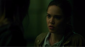 Movie still from “Rings” (2017), directed by F. Javier Gutiérrez – A person wearing a brown jacket; Close Up shot, Over the shoulder angle