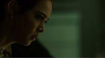 Movie still from “Rings” (2017), directed by F. Javier Gutiérrez – A person looking down at the ground; Close Up shot, Over the shoulder angle