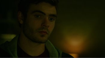 Movie still from “Rings” (2017), directed by F. Javier Gutiérrez – A person looking at the camera; Close Up shot, Over the shoulder angle