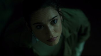 Movie still from “Rings” (2017), directed by F. Javier Gutiérrez – A woman's face in the dark; Close Up shot, Overhead angle