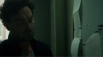 Movie still from “Rings” (2017), directed by F. Javier Gutiérrez – A person looking at a mirror; Close Up shot, High angle