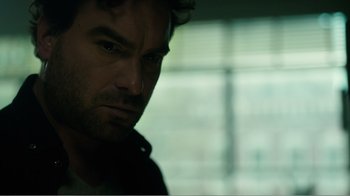 Movie still from “Rings” (2017), directed by F. Javier Gutiérrez – A man's face in front of a window; Close Up shot, Over the shoulder angle
