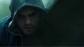 Movie still from “Rings” (2017), directed by F. Javier Gutiérrez – A person wearing a hooded sweatshirt; Extreme Close Up shot, Low angle