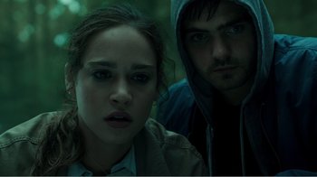 Movie still from “Rings” (2017), directed by F. Javier Gutiérrez – A man and a woman are looking at the camera; Close Up shot, Low angle