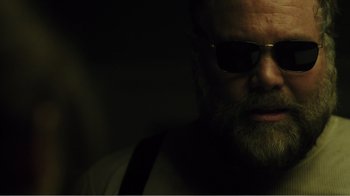 Movie still from “Rings” (2017), directed by F. Javier Gutiérrez – A person wearing sunglasses; Close Up shot, Low angle