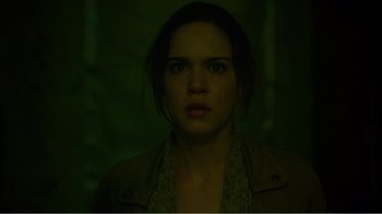 Movie still from “Rings” (2017), directed by F. Javier Gutiérrez – A young woman is staring into the camera; Close Up shot, Low angle