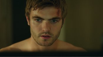 Movie still from “Rings” (2017), directed by F. Javier Gutiérrez – A person looking at a computer screen; Close Up shot, Over the shoulder angle