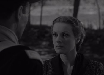 Movie still from “Rio Grande” (1950), directed by John Ford – A man and a woman are looking at one another; Close Up shot, Over the shoulder angle