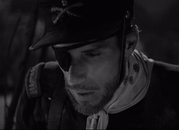 Movie still from “Rio Grande” (1950), directed by John Ford – A person wearing a hat; Close Up shot, Over the shoulder angle