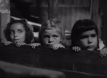 Movie still from “Rio Grande” (1950), directed by John Ford – A group of young girls standing next to each other; Close Up shot, High angle