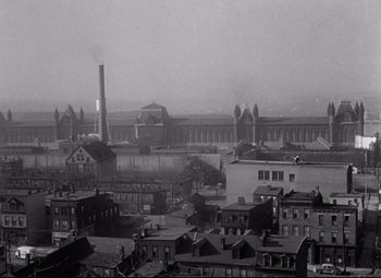 Movie still from “Riot in Cell Block 11” (1954), directed by Don Siegel – An aerial view of an industrial area in the early 2 0 th century; Extreme Wide shot, High angle