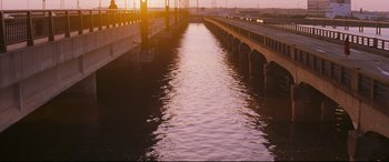 Movie still from “Ritual” (2000), directed by Hideaki Anno – A bridge that has some water in the middle of it; Extreme Wide shot, High angle