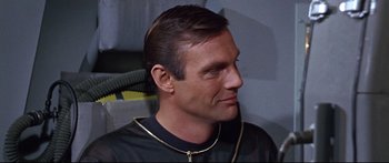 Movie still from “Robinson Crusoe on Mars” (1964), directed by Byron Haskin – A person wearing a necklace; Close Up shot, Over the shoulder angle