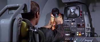 Movie still from “Robinson Crusoe on Mars” (1964), directed by Byron Haskin – A man holding a monkey in his arms; Medium shot, Over the shoulder angle