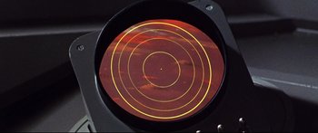 Movie still from “Robinson Crusoe on Mars” (1964), directed by Byron Haskin – A red and yellow circle in a lens; Extreme Close Up shot, High angle