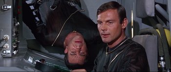 Movie still from “Robinson Crusoe on Mars” (1964), directed by Byron Haskin – Two men are posing for a picture together; Close Up shot, Overhead angle