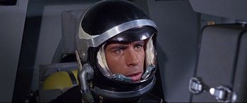 Movie still from “Robinson Crusoe on Mars” (1964), directed by Byron Haskin – A person wearing a space helmet; Close Up shot, Overhead angle