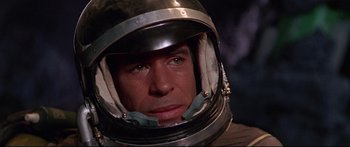 Movie still from “Robinson Crusoe on Mars” (1964), directed by Byron Haskin – A person wearing a space helmet; Close Up shot, High angle