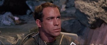 Movie still from “Robinson Crusoe on Mars” (1964), directed by Byron Haskin – A person sitting down; Close Up shot, Over the shoulder angle