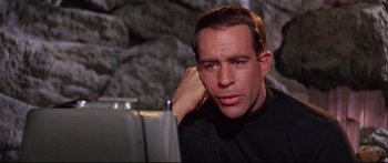 Movie still from “Robinson Crusoe on Mars” (1964), directed by Byron Haskin – A person with his hand on his head; Close Up shot, Low angle