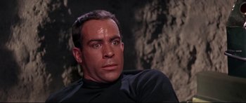 Movie still from “Robinson Crusoe on Mars” (1964), directed by Byron Haskin – A person wearing a black shirt; Close Up shot, Low angle