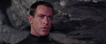 Movie still from “Robinson Crusoe on Mars” (1964), directed by Byron Haskin – A person wearing a suit and tie; Close Up shot, Over the shoulder angle