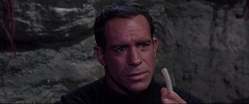 Movie still from “Robinson Crusoe on Mars” (1964), directed by Byron Haskin – A person holding a tooth brush; Close Up shot, High angle