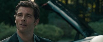 Movie still from “Robot & Frank” (2012), directed by Jake Schreier – A person wearing a suit and tie; Close Up shot, Over the shoulder angle