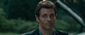 Movie still from “Robot & Frank” (2012), directed by Jake Schreier – A person wearing a suit; Close Up shot, Over the shoulder angle