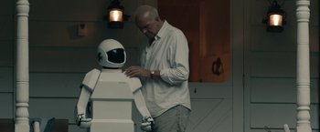 Movie still from “Robot & Frank” (2012), directed by Jake Schreier – An older man standing in front of a robot; Medium shot, Over the shoulder angle