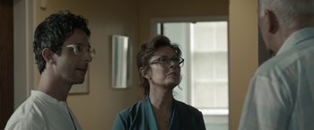 Movie still from “Robot & Frank” (2012), directed by Jake Schreier – A woman wearing glasses looking up in a room; Close Up shot, Over the shoulder angle