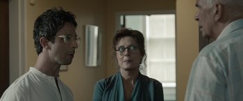 Movie still from “Robot & Frank” (2012), directed by Jake Schreier – A woman wearing glasses and a blue shirt; Close Up shot, Over the shoulder angle