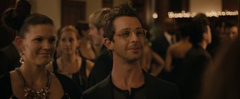 Movie still from “Robot & Frank” (2012), directed by Jake Schreier – A person wearing glasses and a suit; Close Up shot, Over the shoulder angle