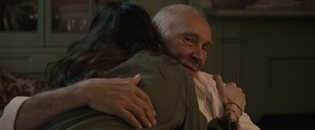 Movie still from “Robot & Frank” (2012), directed by Jake Schreier – An older man is hugging a younger woman; Close Up shot, Over the shoulder angle