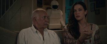 Movie still from “Robot & Frank” (2012), directed by Jake Schreier – An older man and a young woman sitting next to each other; Medium shot, Over the shoulder angle