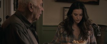 Movie still from “Robot & Frank” (2012), directed by Jake Schreier – An older man and a young woman sitting at a dinner table; Close Up shot, Over the shoulder angle