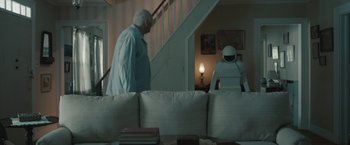 Movie still from “Robot & Frank” (2012), directed by Jake Schreier – A man and a woman are in a living room; Wide shot, Over the shoulder angle