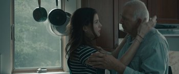 Movie still from “Robot & Frank” (2012), directed by Jake Schreier – An older man helping a young woman with her hair; Close Up shot, Low angle