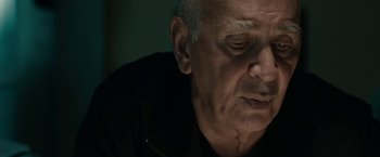 Movie still from “Robot & Frank” (2012), directed by Jake Schreier – An older man is looking down at his face; Close Up shot, Low angle