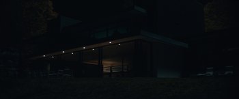 Movie still from “Robot & Frank” (2012), directed by Jake Schreier – A building at night lit up with lights on it; Extreme Wide shot, Low angle