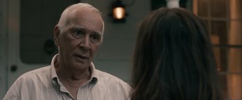 Movie still from “Robot & Frank” (2012), directed by Jake Schreier – An older man and a young woman are talking to each other; Close Up shot, Over the shoulder angle