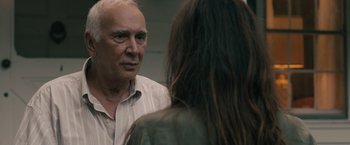 Movie still from “Robot & Frank” (2012), directed by Jake Schreier – An older man talking to a young woman in front of a mirror; Close Up shot, Over the shoulder angle