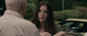 Movie still from “Robot & Frank” (2012), directed by Jake Schreier – A beautiful young woman sitting in front of an older man; Close Up shot, Over the shoulder angle
