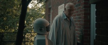 Movie still from “Robot & Frank” (2012), directed by Jake Schreier – An old man and a robot standing next to each other; Medium shot, Over the shoulder angle