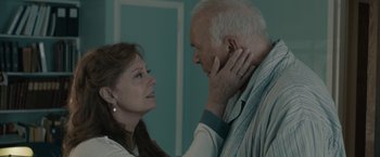 Movie still from “Robot & Frank” (2012), directed by Jake Schreier – An older man and a younger woman are touching each other; Close Up shot, Over the shoulder angle