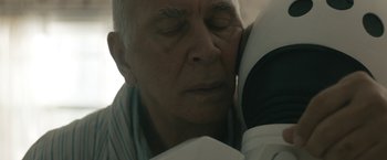Movie still from “Robot & Frank” (2012), directed by Jake Schreier – An older man sleeping with his head on a pillow; Close Up shot, Over the shoulder angle