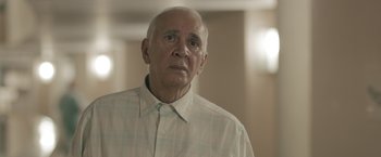 Movie still from “Robot & Frank” (2012), directed by Jake Schreier – An older man wearing a white button up shirt; Close Up shot, Low angle