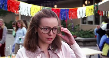 Movie still from “Rock 'n' Roll High School” (1979), directed by Joe Dante – A woman wearing glasses and holding her hand up to her face; Close Up shot, Low angle