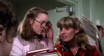 Movie still from “Rock 'n' Roll High School” (1979), directed by Joe Dante – Two young women are looking at each other; Close Up shot, Low angle
